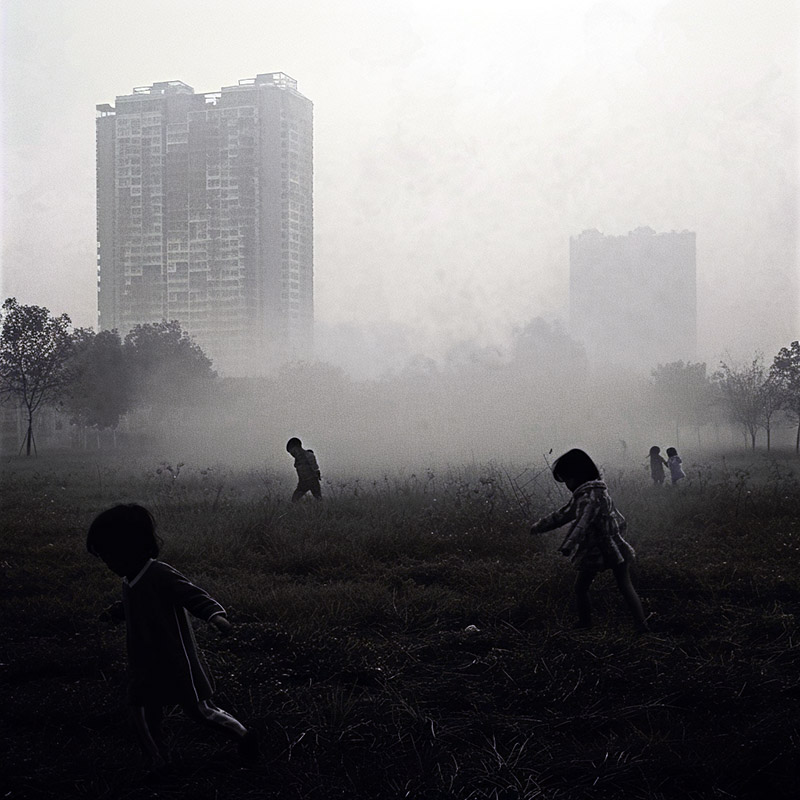 Children Playing in a Hazy Park