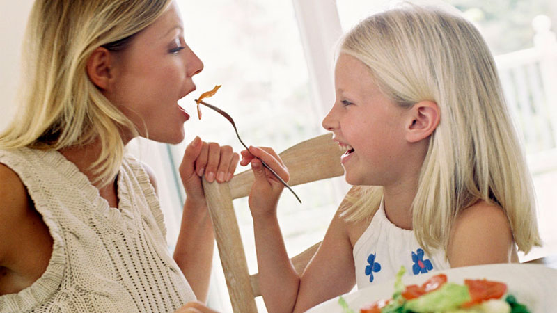 Daughter-feeding-mom.jpg